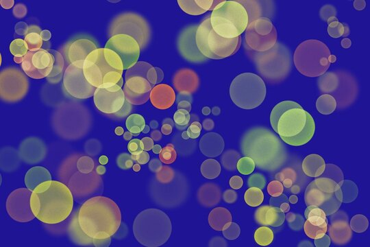 Abstract blue background with glowing circular bokeh and soft bubbles pattern