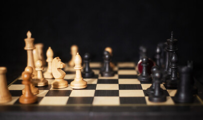 Top view of chessboard with chess pieces, strategic game layout symbolizing goal setting. © ketrin