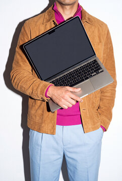 Man Hugging Laptop to Chest