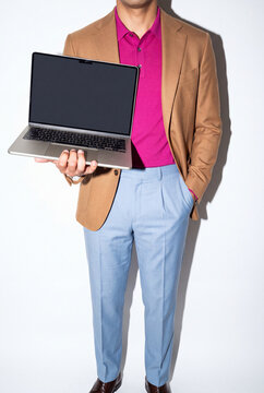 Man in Tan Blazer Showing Laptop