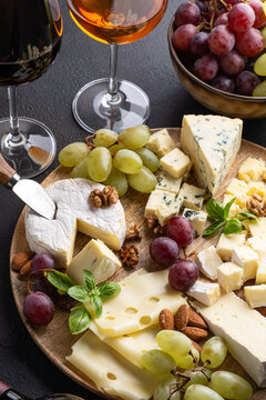 Gourmet cheese platter with wine and fresh fruits perfect for celebrations and gatherings