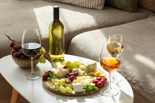 Elegant wine and cheese platter with grapes and artisanal cheese selection for a sophisticated gathering