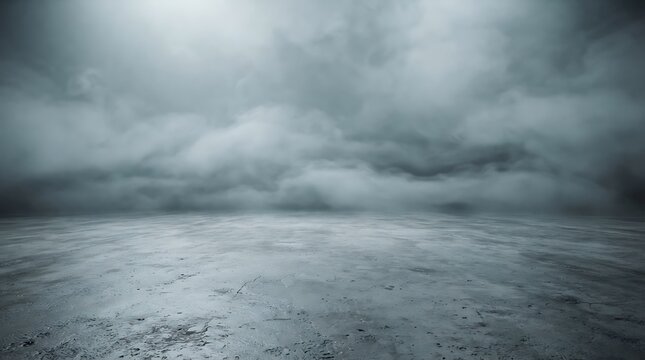A textured concrete floor surface extending toward a horizon filled with thick gray storm clouds with atmospheric outdoor setting