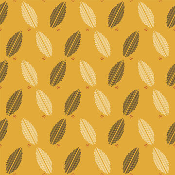 Seamless dotted leaf lattice pattern, charcoal and cream mosaic leaves on mustard yellow vector background