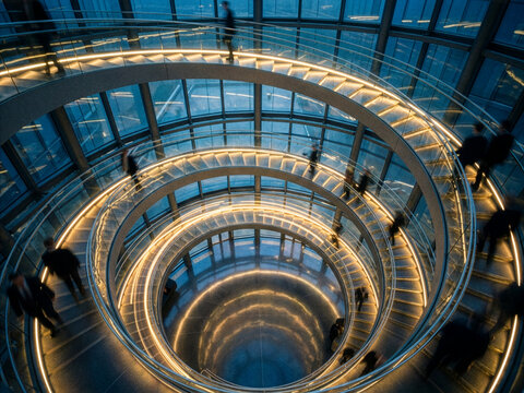 Aerial view of a spiral staircase inside a modern glass skyscraper with modern architecture