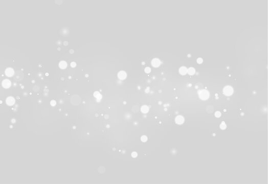 A stream of soft glowing bokeh lights floats against a black background. The lights vary in size and intensity, creating a layered effect. This image is suitable for festive or.