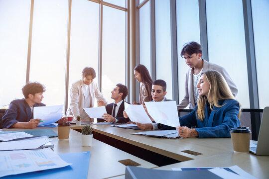 Successful happy workers Group of business people with Multiethnic workers with in company workers Group of asian business people and support Teamwork in the meeting room at modern office.