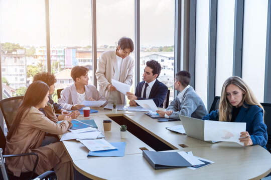 Successful happy workers Group of business people with Multiethnic workers with in company workers Group of asian business people and support Teamwork in the meeting room at modern office.