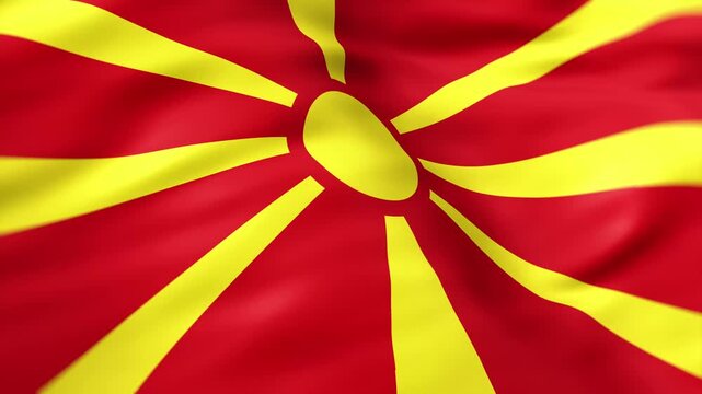 Realistic North Macedonia flag waving in the wind with detailed fabric folds and national symbol background
