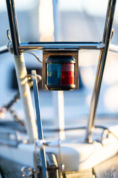 Close up of bicycle rear safety light in urban setting.