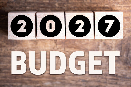 Budget 2027 new year on wooden blocks and office business concept background. 2027 Budget planning and allocation concept concept. 2027 New year resolutions, goals