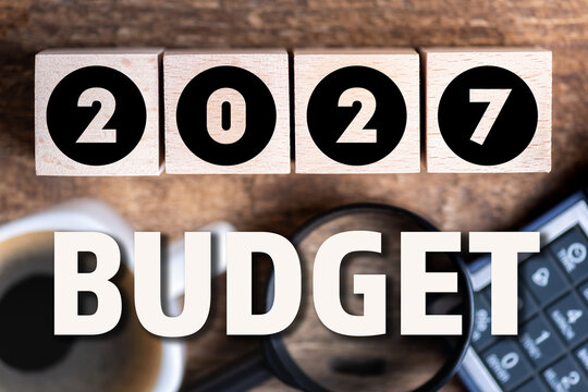 Budget 2027 new year on wooden blocks and office business concept background. 2027 Budget planning and allocation concept concept. 2027 New year resolutions, goals