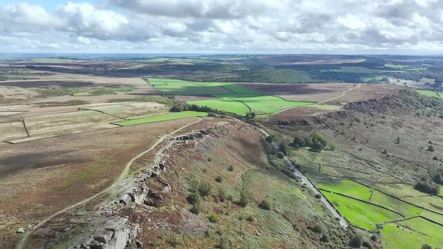 Rocks and Moorland over Curbar Edge and Hope Valley from a drone, Peak District National Park, Curbar, Calver, England, UK