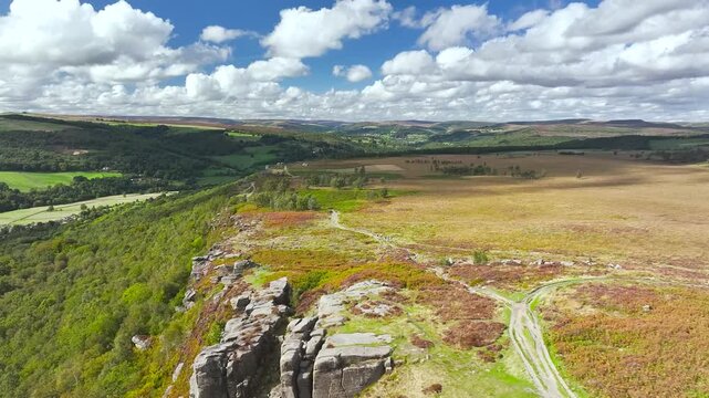 Rocks and Moorland over Curbar Edge and Hope Valley from a drone, Peak District National Park, Curbar, Calver, England, UK