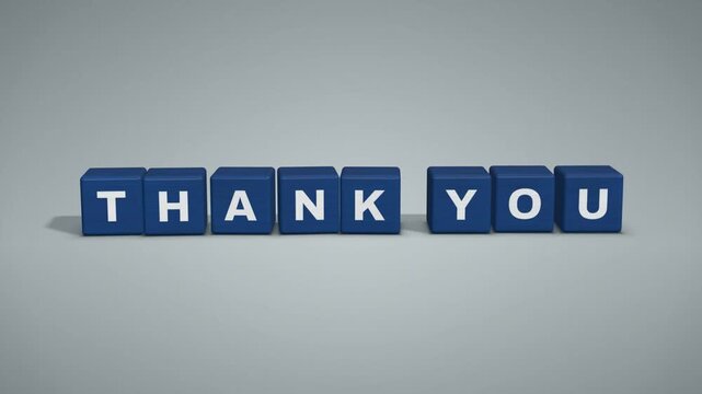 Blue toy letter blocks dropping one by one to spell thank you on grey background