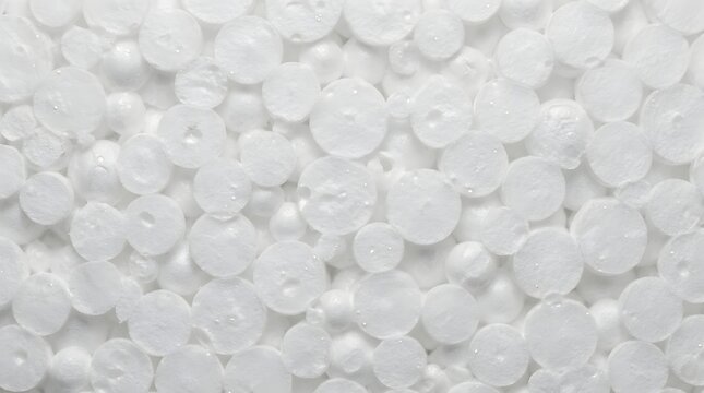 Close-up macro view of white styrofoam beads texture background.