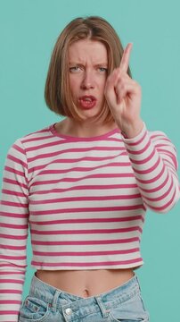 Displeased upset Caucasian woman reacting to unpleasant awful idea, dissatisfied with bad quality, wave hand, shake head No, dismiss idea, dont like proposal. Lady isolated on blue studio background