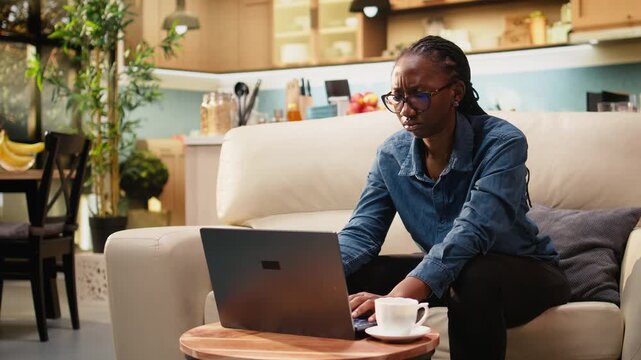 Disoriented woman preoccupied with remote tasks at home