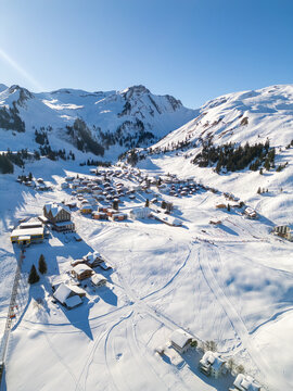 Swiss alpine village stoos enjoying winter landscape sun