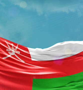 Oman flag banner waving in the sky.
