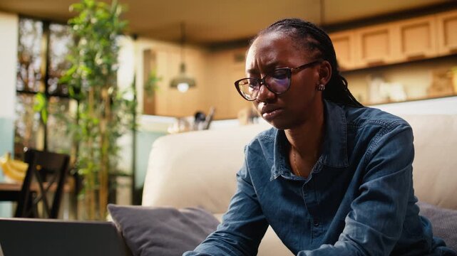Close up of young woman frowning about ambiguous tasks at home