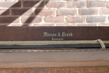 Obraz premium part of an old piano: Mason & Risch, a major Toronto piano maker and music retailer, at The Distillery Historic District