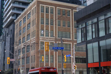 Obraz premium former Canadian Westinghouse Building at 355 King St W, now the Sutton Place Hotel, with historic Westinghouse façade incorporated into the King Blue Developments, Toronto