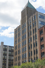 Obraz premium roofline and pyramidal tower at Tower Building designed by Benjamin Brown in Art Deco style located at 110 Spadina Av Garment District, Toronto