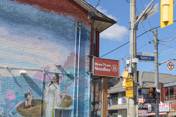 Obraz premium mural and projecting sign at More Than Noodles, a Chinese restaurant, located at 449 Dundas St W, Toronto