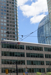 Obraz premium BofA Securities or Bank of America sign on the exterior of Brookfield Place, 161 Bay St with view of L Tower condo, Toronto