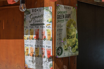 Obraz premium drinks menu outside BOKU Japanese Eats + Drinks, a Japanese restaurant, located at 42 Gristmill Lane, Distillery District, Toronto