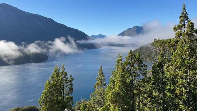 Clouds move across a lake between wooded hills, Mirador Lago Mascardi, time lapse, Nahuel Huapi National Park, Rio Negro Province, Argentina