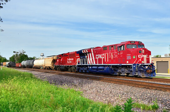A specially painted locomotive to commemorate America's 250th anniversary leads a Canadian Pacific Kansas City freight train through Chicago's northwest suburbs.