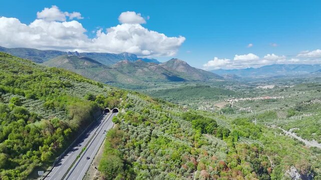 Olive groves, farms and fields over Road E45 from a drone, Polla, Salerno, Campania, Italy