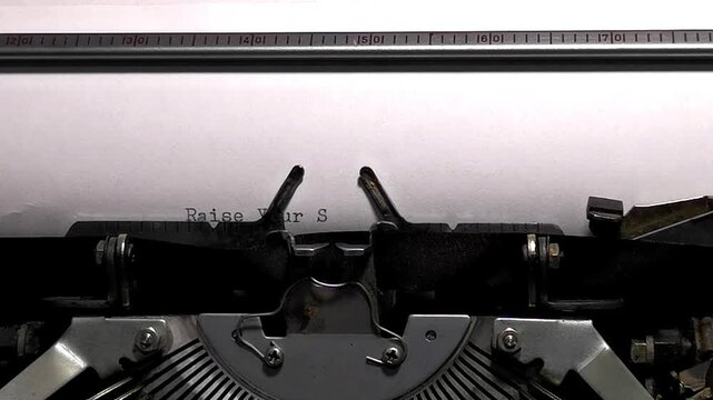 Macro Shot of Vintage Typewriter Typing Raise Your Steins