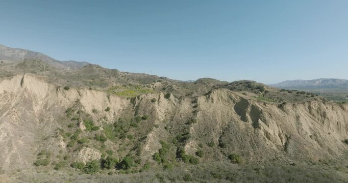 Aerial Drift Across an Eroded Ridgeline