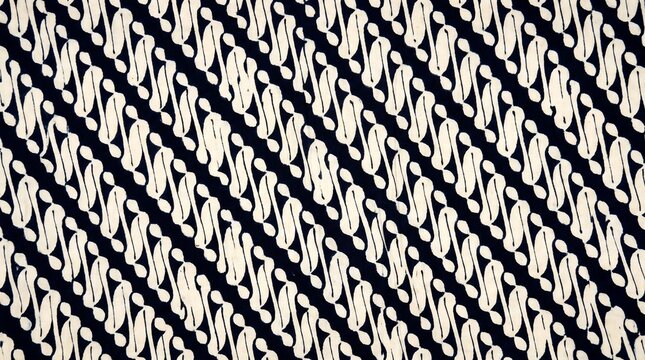 Hyper-realistic studio overhead 1:1 of Yogyakarta Batik Parang Rusak in deep indigo-black and cream-white &mdash; classical Javanese batik as extraordinary studio photography.
