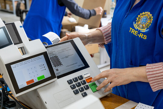 Rio Grande do Sul, Brazil - Sep 23, 2026: TRE-RS worker testing electronic voting machine ahead of Brazilian elections