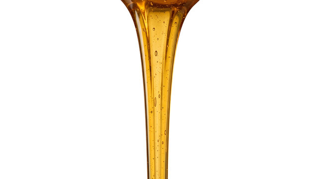 Golden honey liquid pouring down on a transparent background