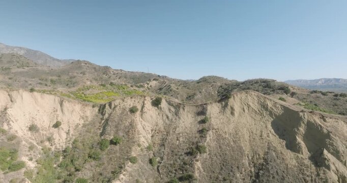 aerial view of desert canyon with rocky cliffs