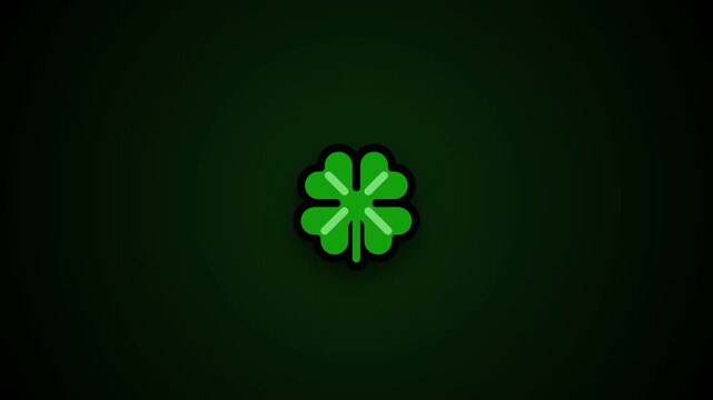 Green four-leaf clover on dark background symbolizing luck and prosperity
