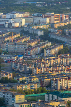 Morning cityscape. Top view of the buildings and streets of the city. Residential urban areas at sunrise. Beautiful aerial city landscape. Petropavlovsk-Kamchatsky, Kamchatka Krai, Far East of Russia.