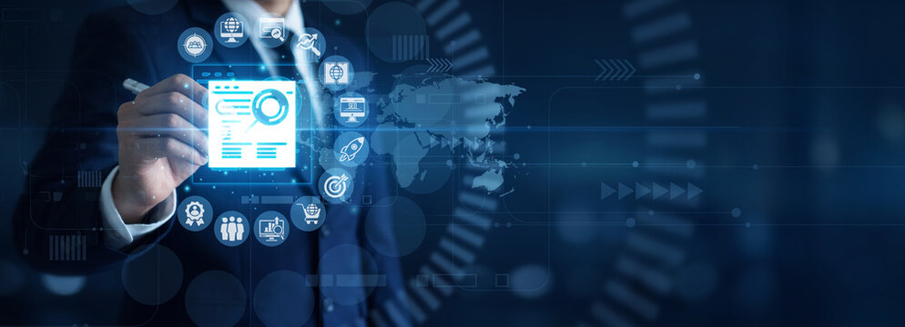 Search visibility. Strategist point of SEO using laptop analyzing website traffic data and keyword ranking metrics on interactive holographic display. Digital marketing optimization.