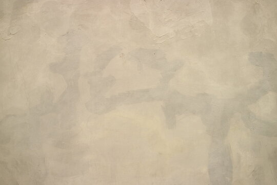 Abstract Neutral Beige Textured Plaster Wall Surface Background with Subtle Grey Tones and Distressed Concrete Finish for Architectural Design
