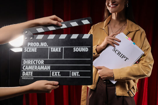 Film production and movie industry, actress holding script with clapperboard on set for cinema casting and entertainment media project development
