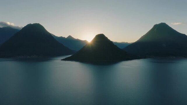 Sunrise over lake atitlan guatemala with volcano silhouettes