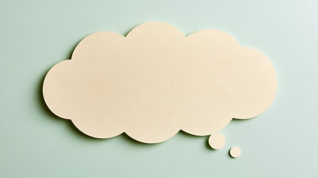 Blank cream thought bubble paper cutout on mint background
