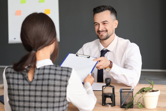 Human resources manager interviewing female applicant in office