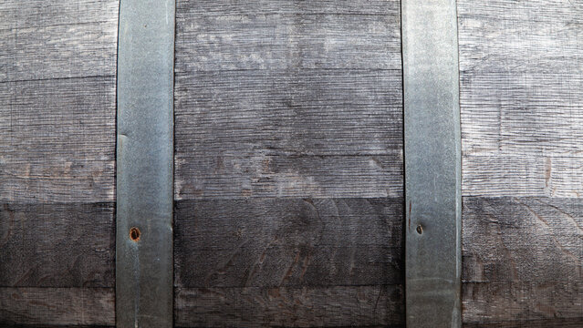 Weathered Oak Wine Barrel Texture with Aged Metal Hoops for Copy Space Backdrop