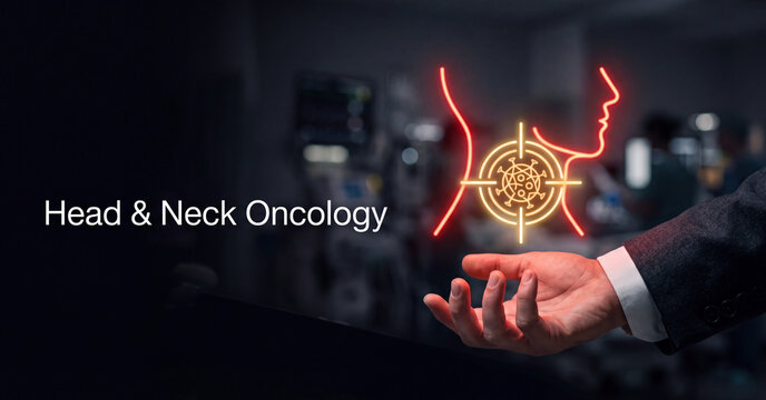 Glowing futuristic medical hologram displaying head and neck oncology research concept with doctor hand gesture in dark hospital interior